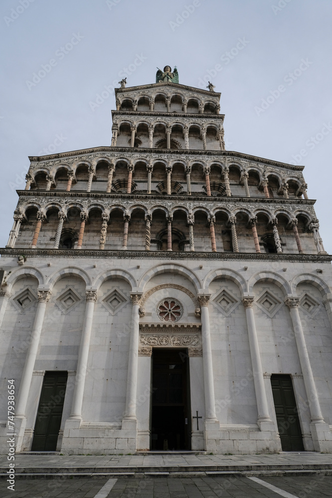 Marble facade of the Basilica church San Michele in Foro from beneath in Lucca, Tuscany, Italy