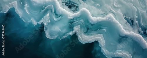 Abstract patterns of frozen ice floes adrift in the serene Arctic sea photo