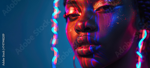 portrait of a young beautiful woman with fluorescent prints on her face. fluorescent prints that glow in ultraviolet rays.