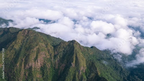 Aerial fly drone hyperlapse foggy or the clouds while sunrise sky, sea of fog mount nature.