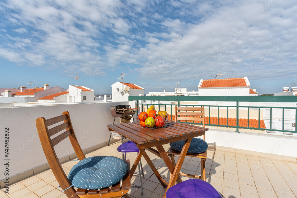 Traditional Portuguese terrace with table and fruit overlooking the village.