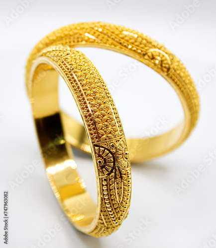 Indian design gold bangle isolated on white background