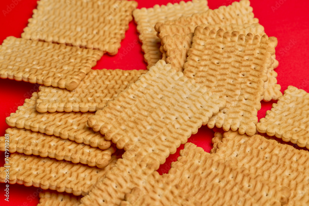 petit beurre biscuits, on a red background. petit beurre biscuits, on a red background.
