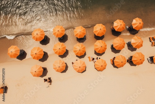 an aerial view of a beach with umbrellas photo