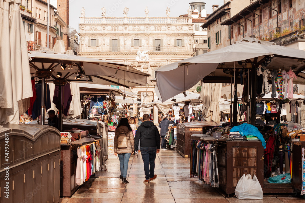 Piazza delle Erbe market - Tourism in the beautiful historical city center of Verona, Italy
