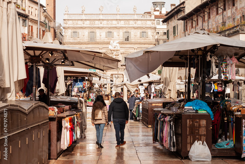 Piazza delle Erbe market - Tourism in the beautiful historical city center of Verona, Italy photo