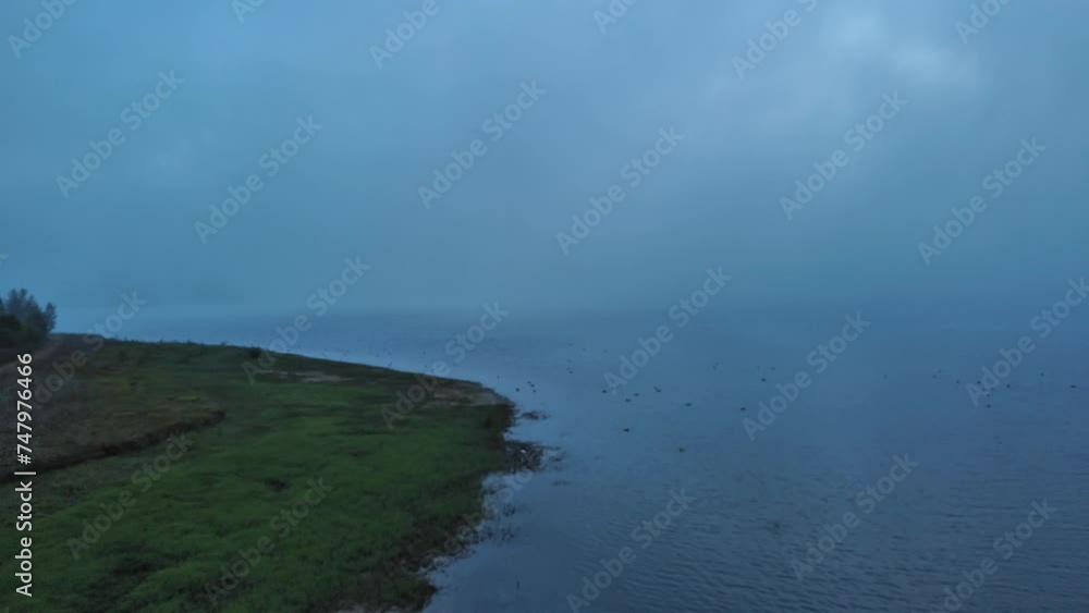 Dusk over Nanclares de Gamboa reservoir, tranquil water, serene Basque landscape