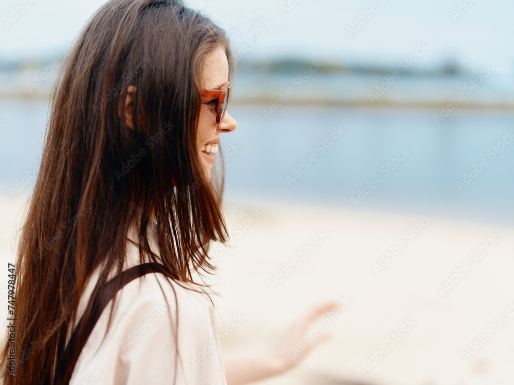 Sun-kissed Beauty: A Young Woman Enjoying a Summer Vacation at the Beach, Radiating Happiness and Relaxation, Against the Serene Backdrop of the Ocean Sun-kissed Beauty: A Young Woman Enjoying a Summer Vacation at the Beach, Radiating Happiness and Relaxation, Against the Serene Backdrop of the Ocean