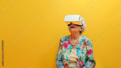 old woman with VR glasses isolated on yellow background with copy space

