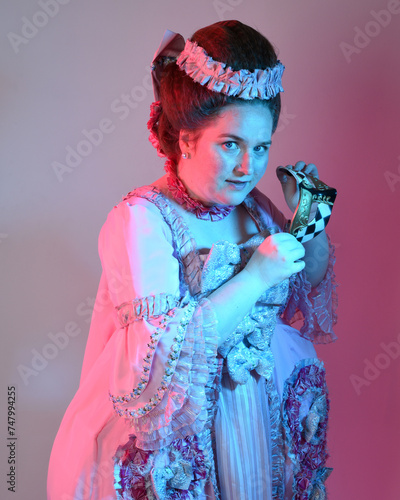  portrait of female model wearing an opulent pink gown, costume of a historical French baroque nobility, style of Marie Antoinette. Isolated on studio background cinematic colourful lighting