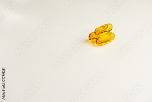 Omega 3 pills showcased, promoting a healthy lifestyle, against a white background. Perfect for wellness and nutrition concepts