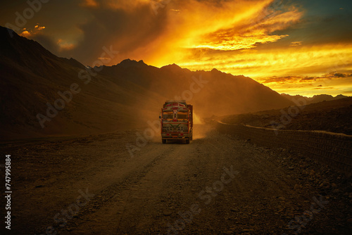Cargo truck on the mountain road in Ladakh during sunset