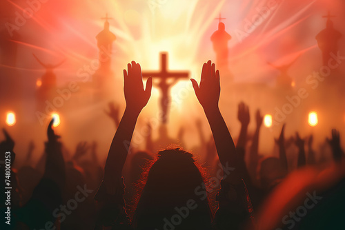 The concept of worship of God. People raised their hands in front of the cross.