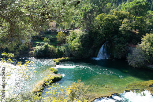 Krka National Park, Split, Croatia. Waterfall surrounded by green landscape and forest. Located in the region of Dalmatia. 