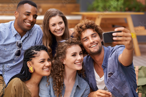 Friends, happy and selfie on campus for memory with care and profile picture to update on social media. Students, diversity or cellphone for photography at university or bonding together in outdoor