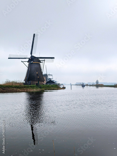 A Dutch lansdscape photo from a mill near the water photo