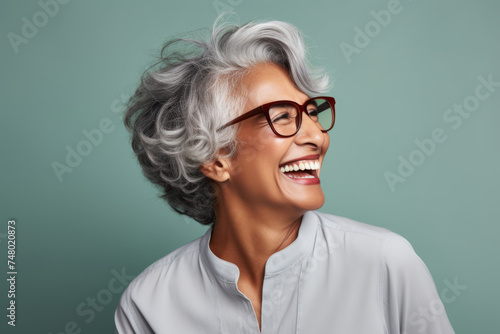 Portrait of a senior Indian ethnic woman with a cheering face