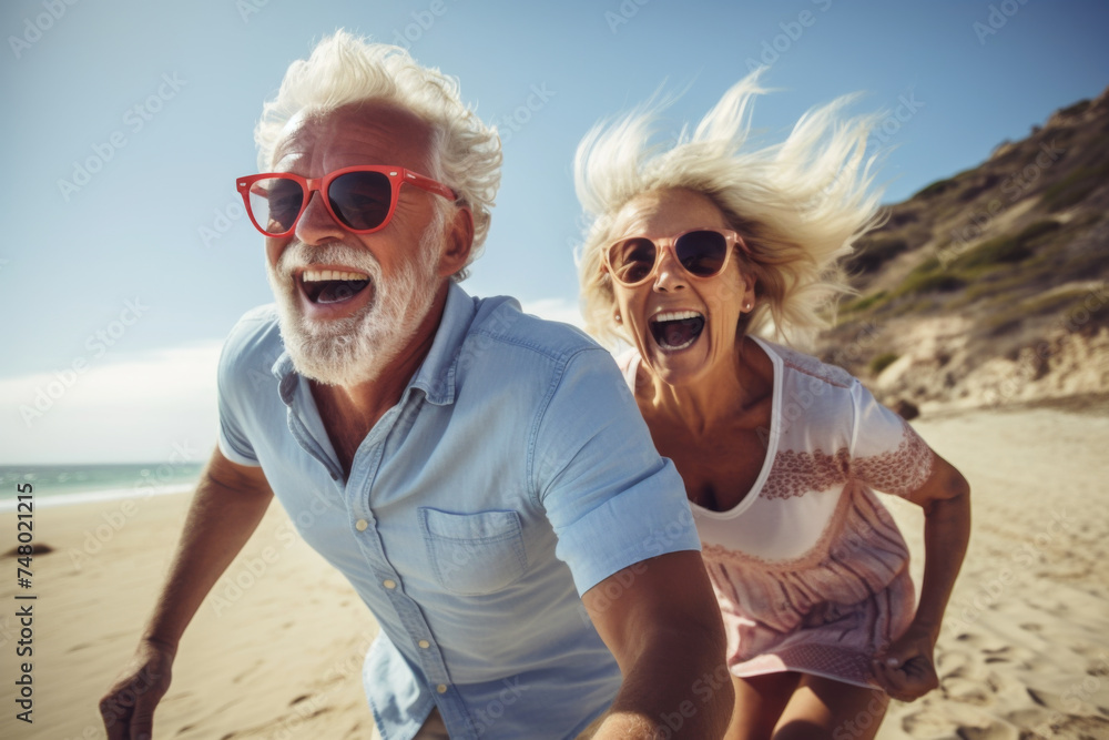 Fun loving elderly couple holidaying in a beach Fun loving elderly couple holidaying in a beach