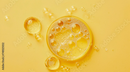 Golden yellow bubble oil or serum isolated.