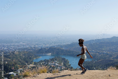 Sexy and Fit African American Woman Wearing Sports Outfit While Hiking in Hollywood, Los Angeles in a Sunny Afternoon
