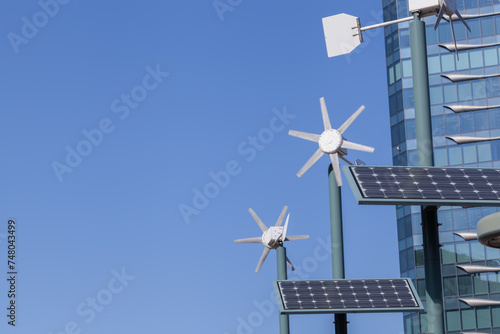 Hybrid wind and solar power generation systems on blue sky background