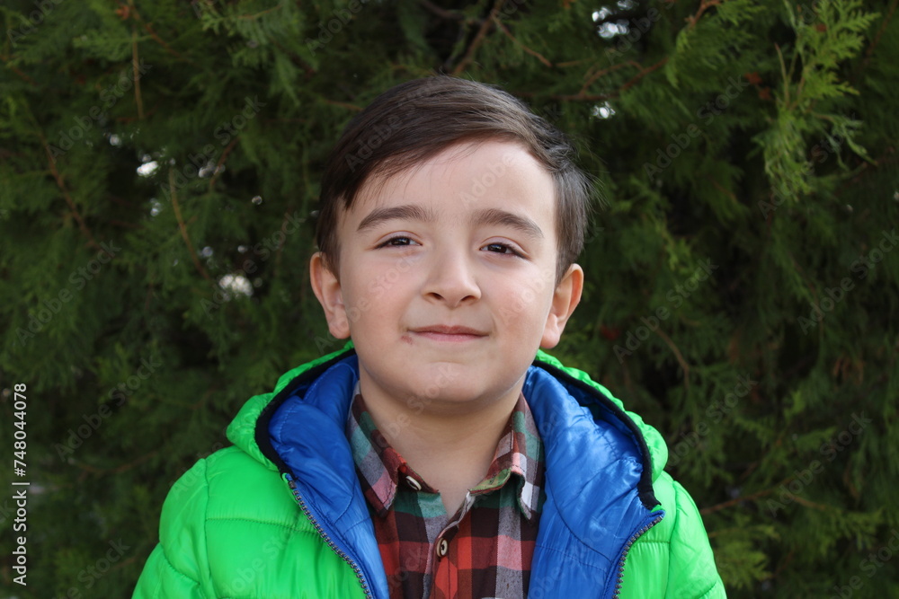 A happy and sweet Turkish boy. peaceful and handsome face. happiness. A happy and sweet Turkish boy. peaceful and handsome face. happiness.
