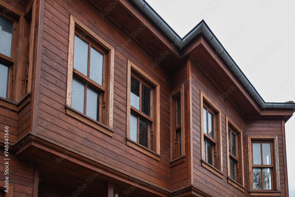 House made of laminated veneer lumber. Cottage made of laminated wood. Houses made of wood