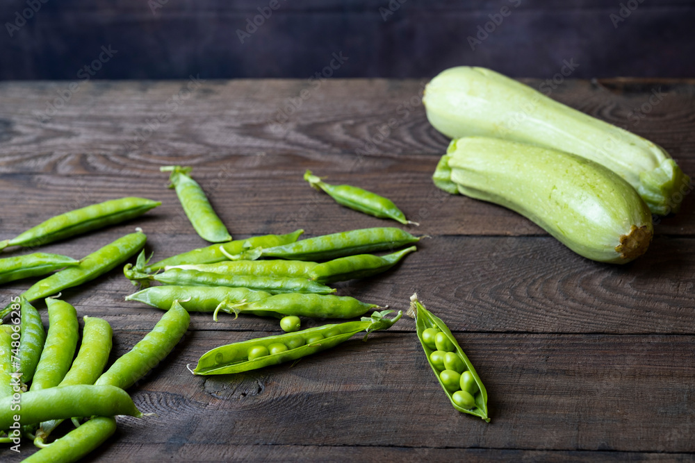 Ripe green peas on a wooden table. Ripe green peas on a wooden table.