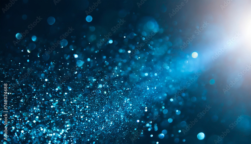Abstract dark blue glittering background. Sparkle dust texture. Festive backdrop. Abstract dark blue glittering background. Sparkle dust texture. Festive backdrop.