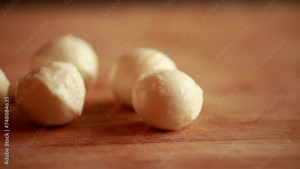 mozzarella balls on wooden board close-up mozzarella balls on wooden board close-up