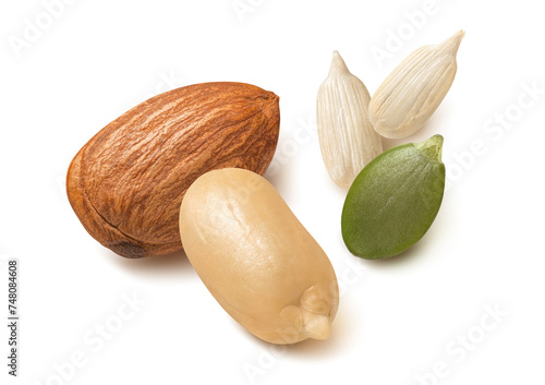 Separate nuts, almond, peanut, sunflower and pumpkin seeds isolated on white background.