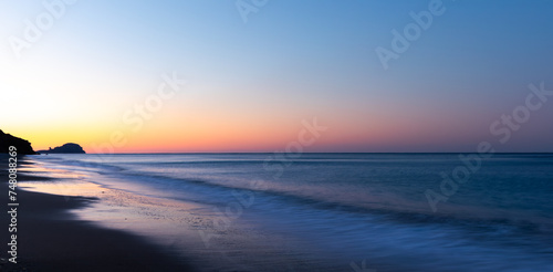 Sunrise on Yanıklı beach and waves with long exposure