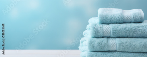 Light blue spa towels pile. Bath towels lying.