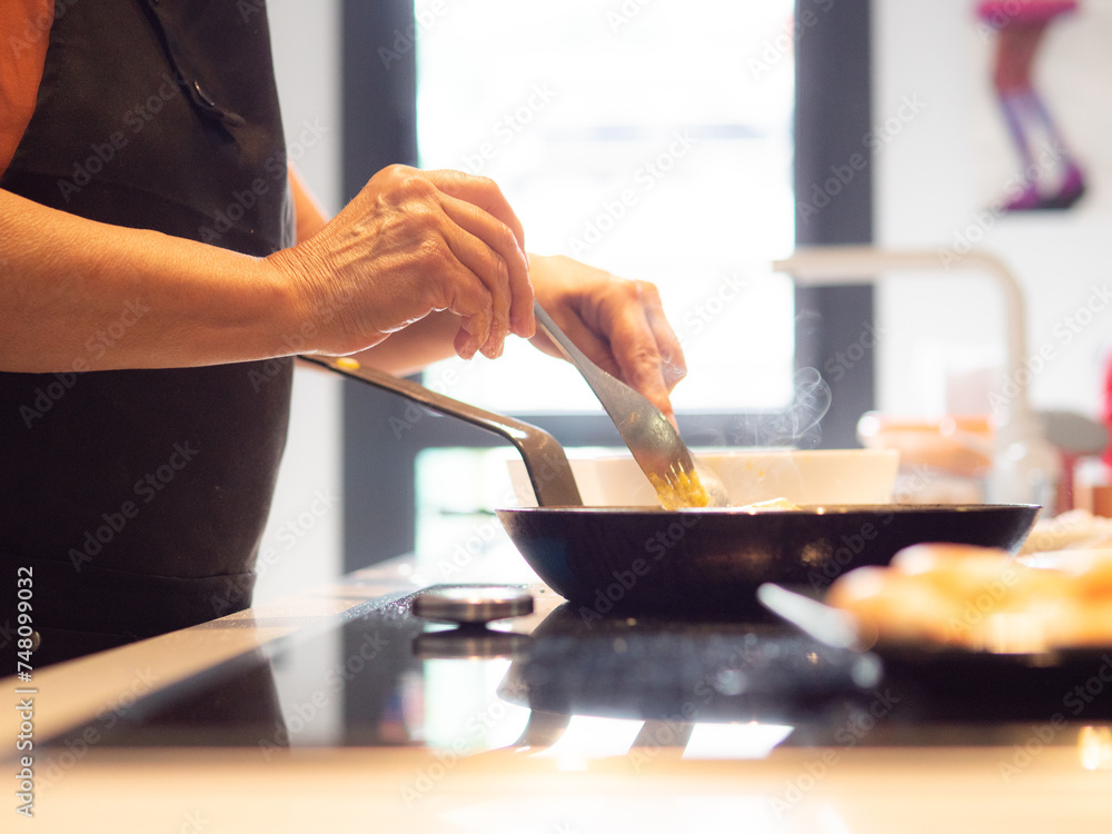 anonymous senior woman cooking anonymous senior woman cooking