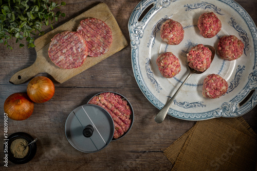 cooking from scratch homemade beef burgers being formed in a burger press