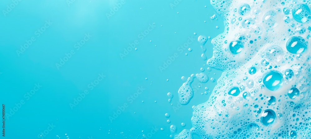 washroom background with foam and bubbles, on a blue bathroom surface, horizontal wallpaper wellnes, refreshment and cosmetics concept, copy space for text - obrazy, fototapety, plakaty 