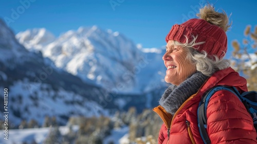 A senior woman enjoys a scenic winter hike in the mountains