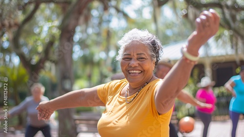 Senior woman smiling and following the instructor's moves during a fun-filled Zumba workout 