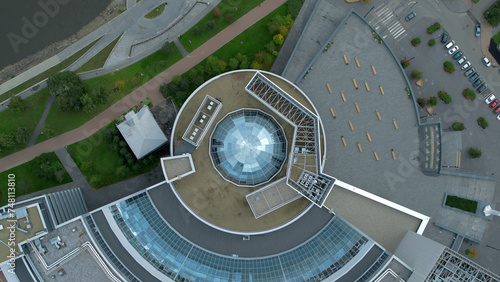 Top view of modern round building with dome. Stock footage. Beautiful architecture of business center with round structure and dome. Rings of building with beautiful facade