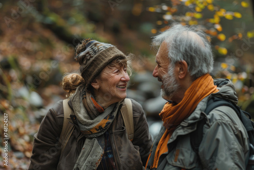 Happy senior couple talking while enjoying in walk in nature