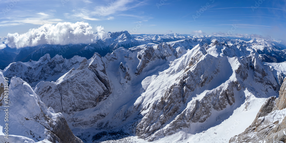 Panoramic View of Majestic Snow-Covered Mountains under Clear Sky