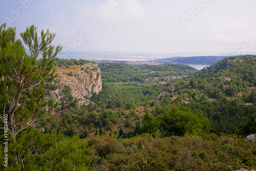View over the town of Gruissan from a cliff on the Massif de la Clape, an upland area with views to the far Mediterranean: Aude, Occitanie, France