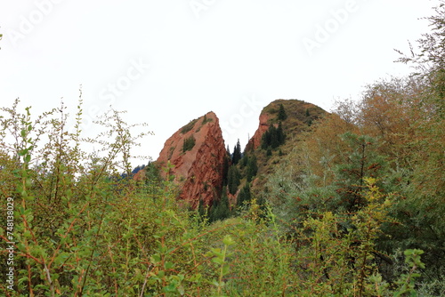 Broken heart cliff. Unusual rock formations from red sandstone in canyon Seven bulls in Jeti-Oguz, Kyrgyzstan photo