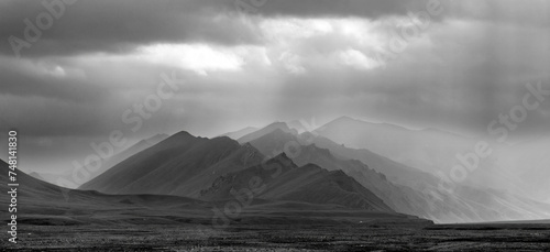 Photography black and white landscape of twilight mountains in the haze of rain
