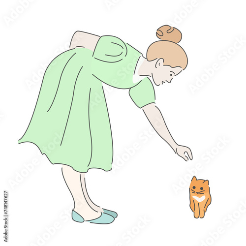 a girl in green dress with a kitten