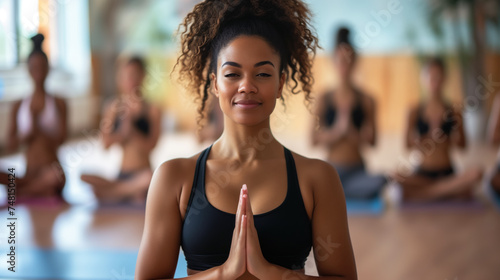 African American Yoga Instructor Leading Meditation Class