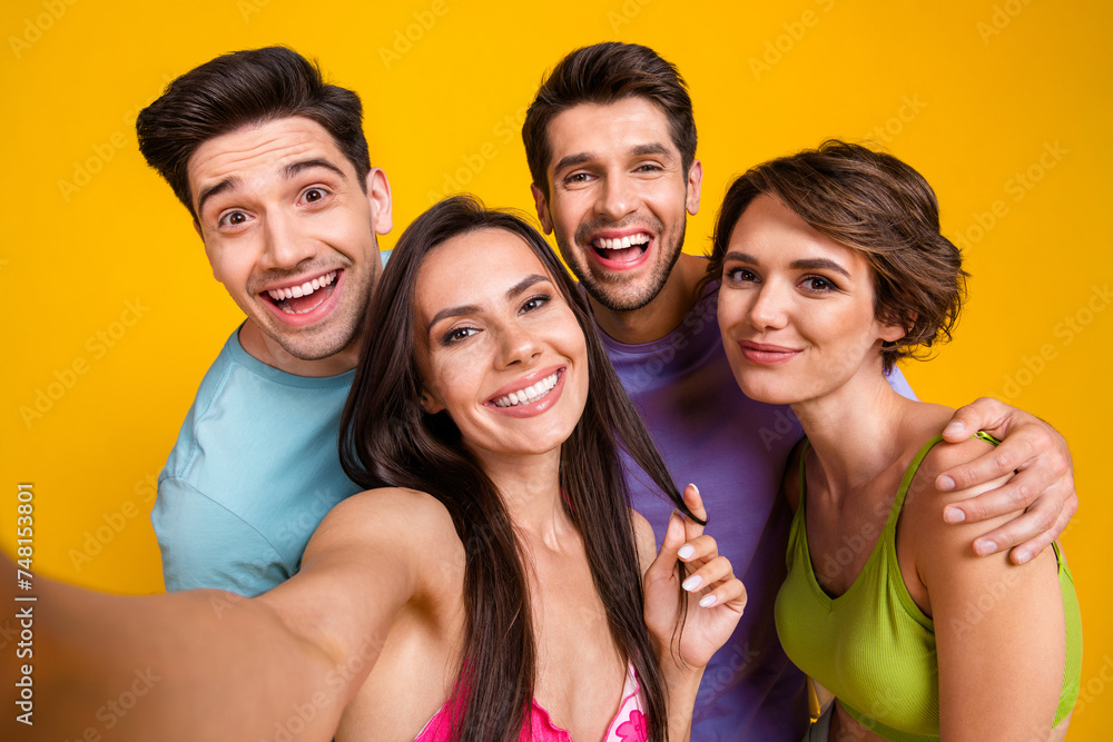 Selfie photo of four people gathering together rest relax isolated over vivid color background Selfie photo of four people gathering together rest relax isolated over vivid color background