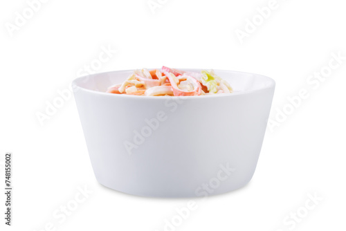 Japanese kani salad with fresh vegetables and crab sticks on a white isolated background photo