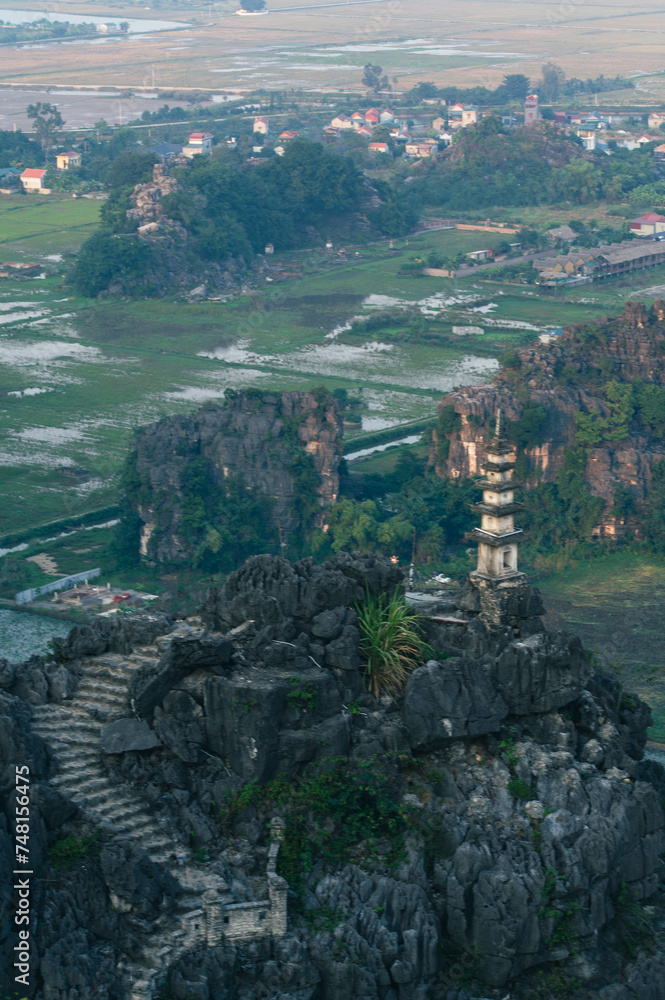 Fototapeta premium Sunset Views of of Dam sen Hang Mua in Northern Vietnam Overlooking the Ninh Binh Region of rice fields.