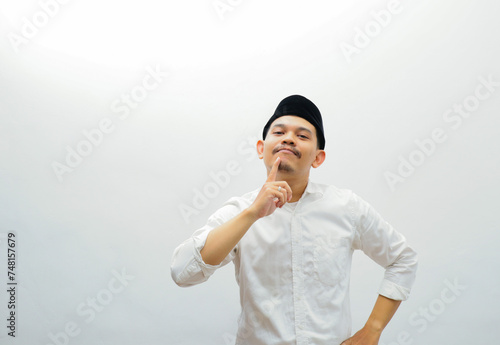 asian muslim man showing confused expression